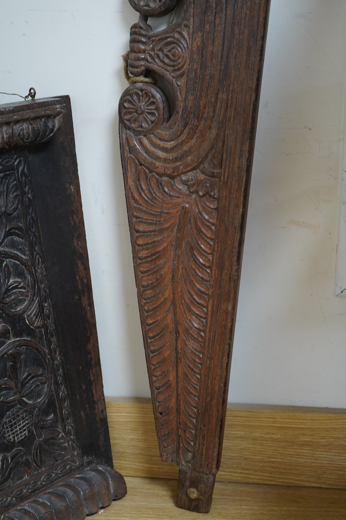 An Anglo-Indian carved wood crest and a similar door portico, latter 127cm in length